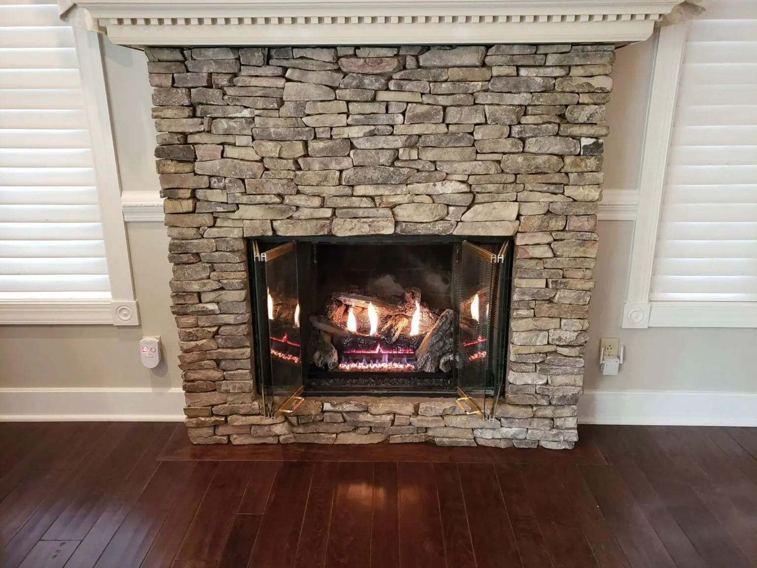 Gas fireplace with a stone surround