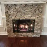 Gas fireplace with a stone surround