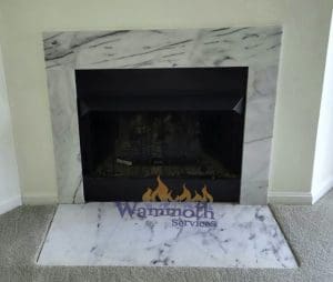 Gas_Fireplace_Before Wammoth gas fireplace turned off with front marble hearth